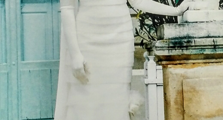 Élégante robe de mariée ivoire en organza de chez Hervé Mariage, pour femme simple.